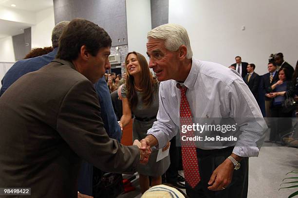 Florida Governor Charlie Crist and his wife Carole Rome Crist greet people during a dedication ceremony at the Alonzo & Tracey Mourning Senior High...