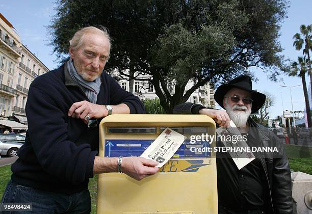 British actor Charles Dance and multi-million-selling author Terry Pratchett pose, posting a letter promoting "Going Postal" a television adaptation...