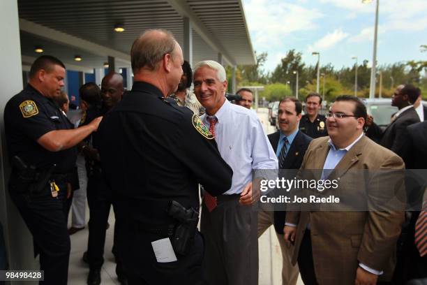 Florida Governor Charlie Crist greets police officers during a dedication ceremony at the Alonzo & Tracey Mourning Senior High School on April 16,...
