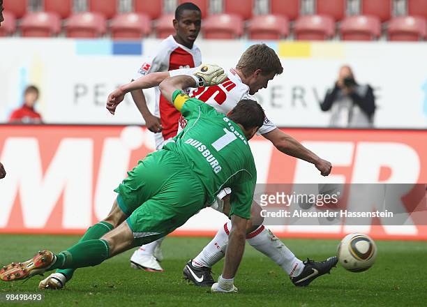 Stephan Hain of Augsburg scores the opening goal against keeper Tom Starke of Duisburg during the Second Bundesliga match between FC Augsburg and MSV...