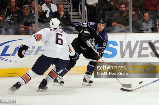 Ryan Smyth of the Los Angeles Kings skates with the puck against Ryan Whitney of the Edmonton Oilers on April 10, 2010 at Staples Center in Los...