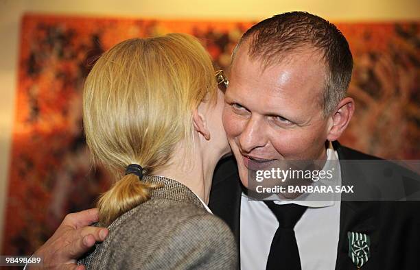 German theatre director Thomas Ostermeier is congratulated by Australian actress Cate Blanchett after he was awarded a prize on April 16, 2010 at the...