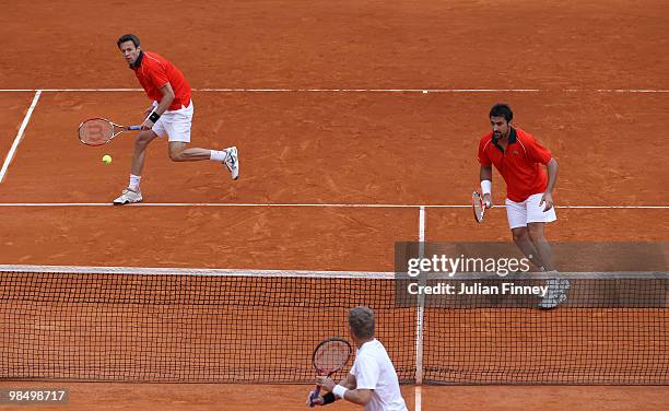 Nenad Zimonjic of Serbia and Daniel Nestor of Canada in action in their doubles match against Mark Knowles of Bahamas and Bruno Soares of Brazil...