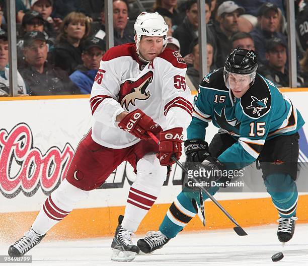 Ed Jovanovski of the Phoenix Coyotes, stick checks the puck from Dany Heatley of the San Jose Sharks during an NHL game on April 10, 2010 at HP...