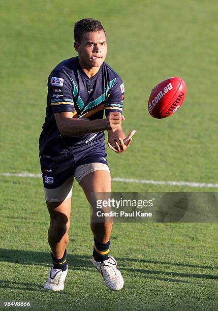 Gerald Ugle of the AIS handballs during the trial match between the AIS AFL Academy and West Perth at Subiaco Oval on April 16, 2010 in Perth,...