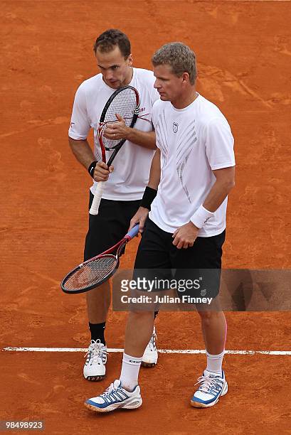 Mark Knowles of Bahamas and Bruno Soares of Brazil look on in their doubles match against Nenad Zimonjic of Serbia and Daniel Nestor of Canada during...