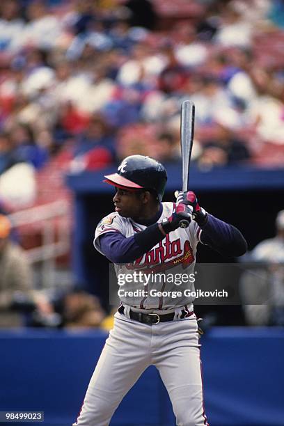 Outfielder Deion Sanders of the Atlanta Braves bats against the Pittsburgh Pirates during a Major League Baseball game at Three Rivers Stadium in...