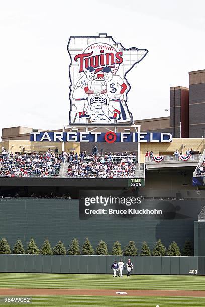 April 12: Pitching coach Rick Anderson, Carl Pavano, and Joe Mauer walk from the bullpen to the dugout across center field prior to the start of the...