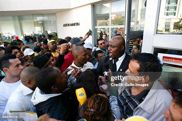 Security guards attempt to calm a crowd outside a 2010 FIFA World Cup ticket sales office on April 15, 2010 in Sandton, South Africa. Some fans...