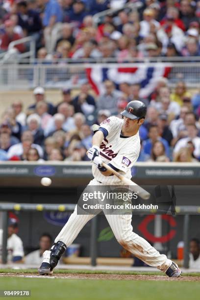 April 12: Joe Mauer of the Minnesota Twins bats against the Boston Red Sox on April 12, 2010 at Target Field in Minneapolis, Minnesota. The Twins won...