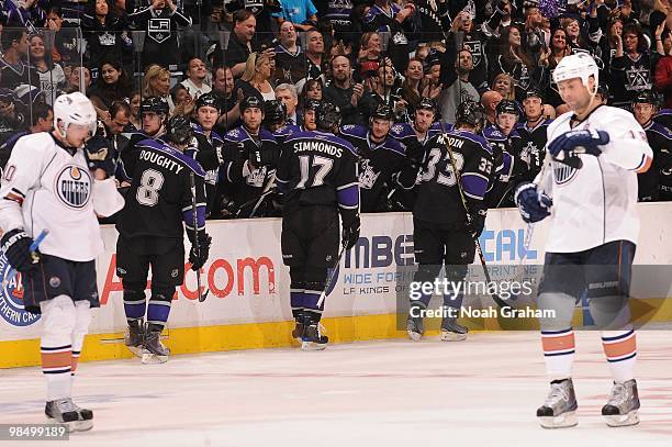 Drew Doughty, Wayne Simmonds and Fredrik Modin of the Los Angeles Kings celebrate with the bench after a goal against the Edmonton Oilers on April...