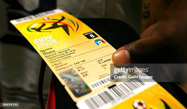 Football supporter holds the tickets he purchased at a 2010 FIFA World Cup ticket sales office on April 15, 2010 in Sandton, South Africa. Some fans...