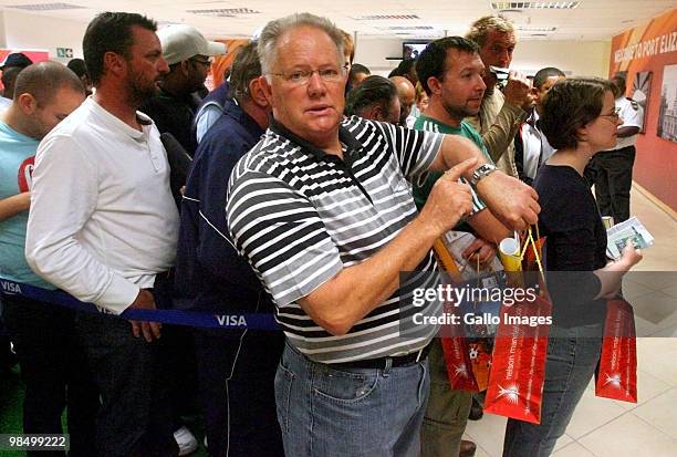 Tired and frustrated fans wait to buy soccer tickets at a 2010 FIFA World Cup ticket sales office at Moffet on Main on April 15, 2010 in Port...