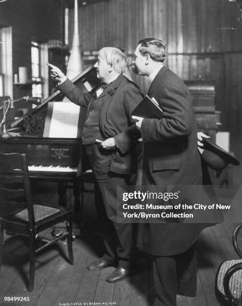 American inventor Thomas Edison showing a visitor around his laboratory in West Orange, New Jersey, 1906.