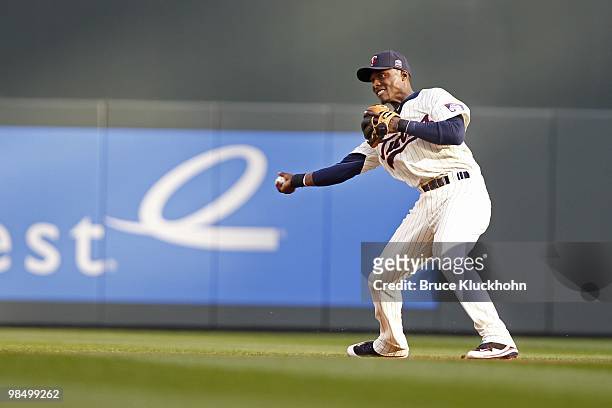 April 12: Orlando Hudson of the Minnesota Twins throws to second base to put out the Boston Red Sox on April 12, 2010 at Target Field in Minneapolis,...