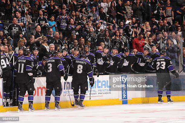 Anze Kopitar, Jack Johnson, Drew Doughty and Dustin Brown of the Los Angeles Kings celebrate with the bench against the Edmonton Oilers on April 10,...