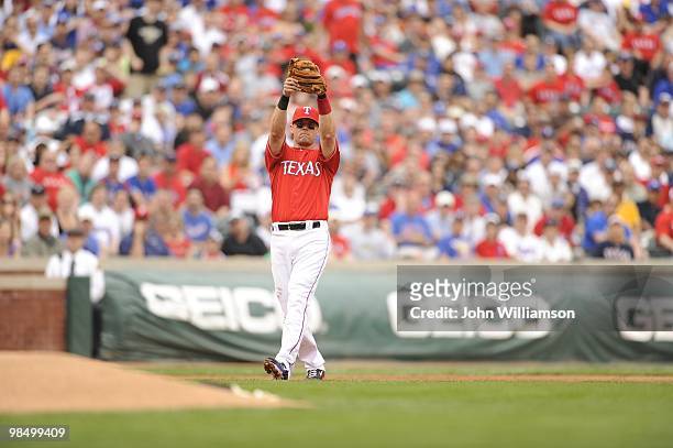 Third baseman Michael Young of the Texas Rangers fields his position as he catches a pop fly during the game against the Toronto Blue Jays at Rangers...