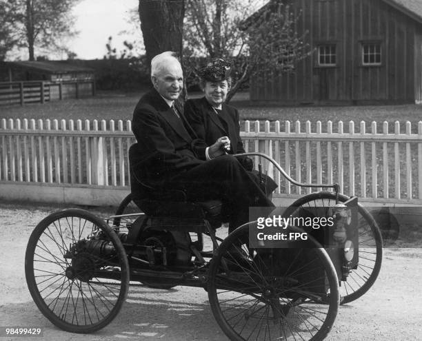 American industrialist and founder of the Ford Motor Company Henry Ford with his wife Clara on his first ever vehicle, the Ford Quadricycle, 1946....