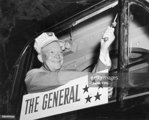 American General and President of Columbia University, Dwight D. Eisenhower drives the re-fitted Pennsylvania Railroad train The General for the...