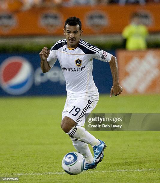 Juninho of the Los Angeles Galaxy brings the ball up the field against the Houston Dynamo on April 10, 2010 in Houston, Texas.