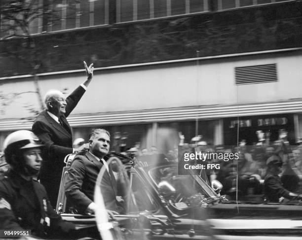 Outgoing U.S. President Dwight D. Eisenhower waves to crowds on Rockefeller Plaza, New York, during the US presidential election, October 1960.