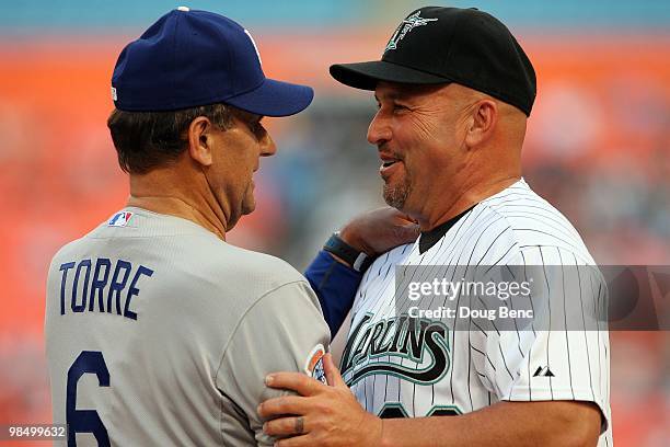 Manager Joe Torre of the Los Angeles Dodgers greets manager Fredi Gonzalez of the Florida Marlins before the Marlins home opening game at Sun Life...