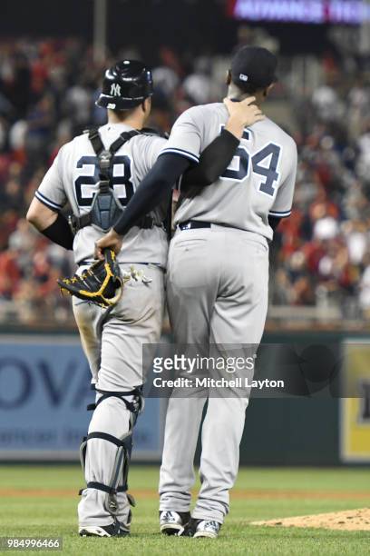 Austin Romine and Aroldis Chapman of the New York Yankees celebrate a win after game two of a doubleheader against the Baltimore Orioles at Nationals...
