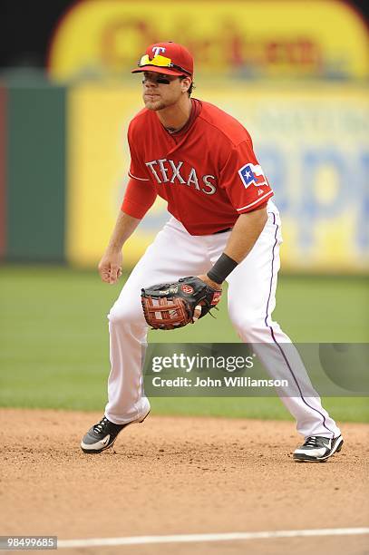 First baseman Chris Davis of the Texas Rangers reacts to the pitch as he looks to home plate from his position in the field during the game against...