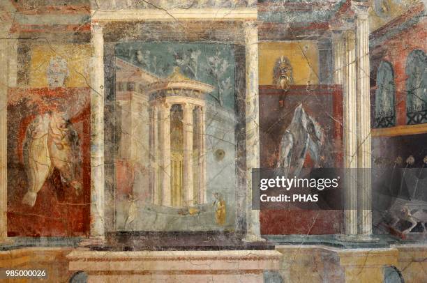 Roman fresco depicting the entrance to a shrine with a tholos on a podium, with a statue of Venus Anadiomena to which two women bring offerings of...