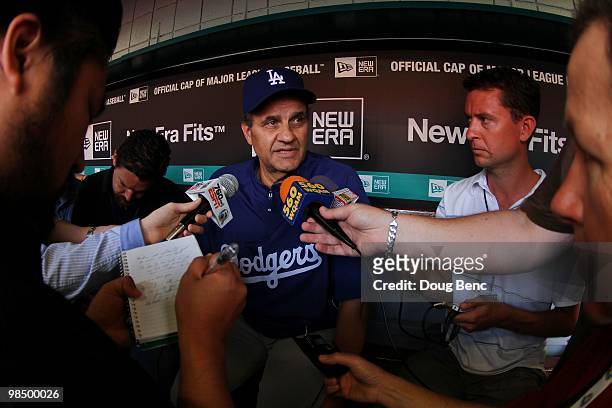 Manager Joe Torre of the Los Angeles Dodgers talks with reporters before taking on the Florida Marlins during the Marlins home opening game at Sun...