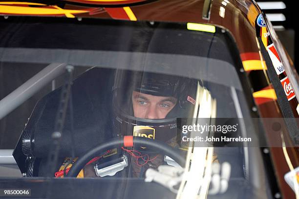 David Ragan, driver of the UPS Ford, sits in his car during practice for the NASCAR Sprint Cup Series Samsung Mobile 500 at Texas Motor Speedway on...