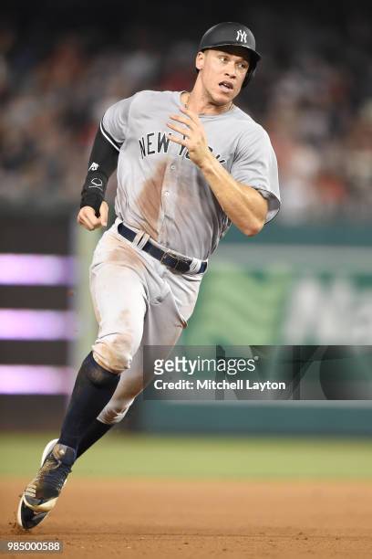 Aaron Judge of the New York Yankees runs to third base during game two of a doubleheader against the Baltimore Orioles at Nationals Park on June 18,...