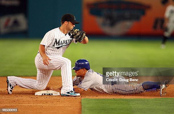 Second baseman Dan Uggla of the Florida Marlins takes the throw as Rafail Furcal the Los Angeles Dodgers steals second base in the Marlins home...