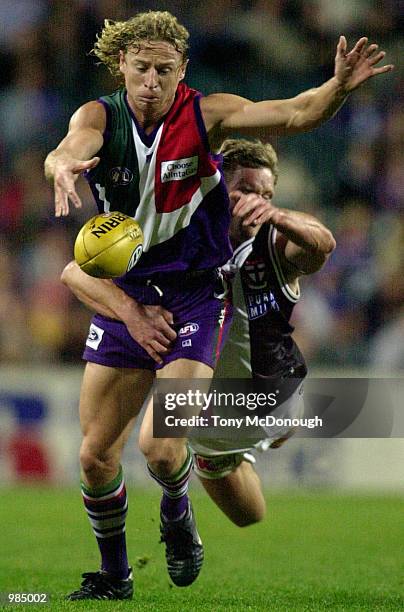 Shaun McManus for the Fremantle kicks the ball, in the match between the Fremantle Dockers and the St Kilda, during round Twelve of the AFL season,...