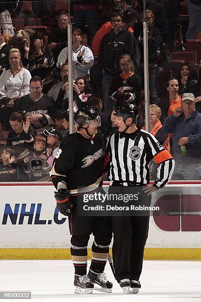 Teemu Selanne of the Anaheim Ducks talks with referee Brad Watson on the ice after a 7-2 win over the Edmonton Oilers on April 11, 2010 at Honda...