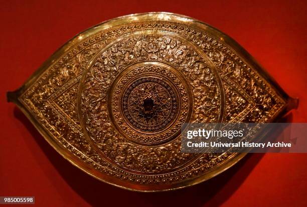 Gilded silver Buckle. Malaysia , 1800-1900; Malay men wore a sash with a buckle to hold up their sarong or lower garment This especially elaborate...