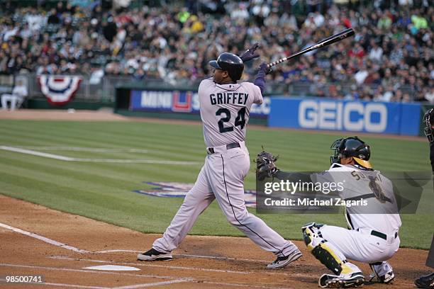 Ken Griffey Jr. #24 of the Seattle Mariners hitting during the game against the Oakland Athletics at the Oakland Coliseum in Oakland, California on...