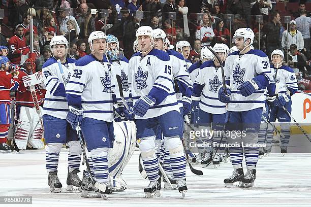 Tomas Kaberle of the Toronto Maple Leafs celebrates the victory with Francois Beauchemin during the NHL game on April 10, 2010 at the Bell Center in...