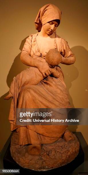 Statue of a peasant woman nursing a baby by Jules Dalou a French sculptor. Dated 19th Century.