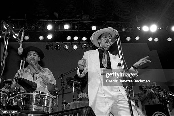 American musician August Darnell performs on stage as Kid Creole and the Coconuts, London, England, 1981. Virbaphonist Andy Hernandez, as Coati...