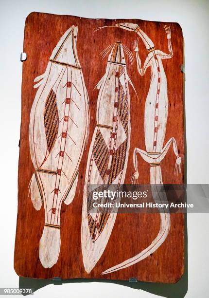 Painted wood depicting a Catfish and Lizard from North Australia. Dated 20th Century.