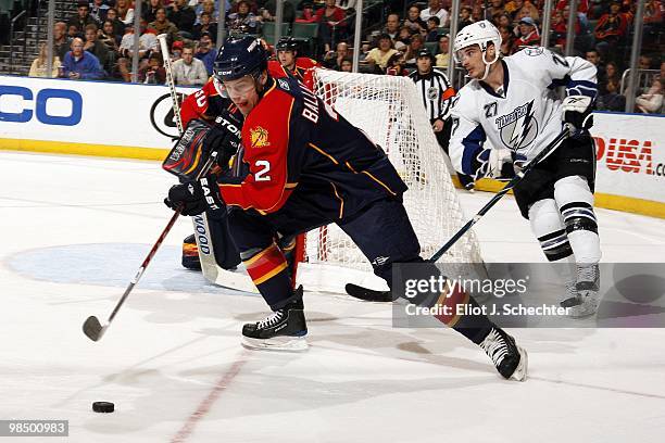 Keith Ballard of the Florida Panthers skates with the puck against the Tampa Bay Lightning at the BankAtlantic Center on April 11, 2010 in Sunrise,...