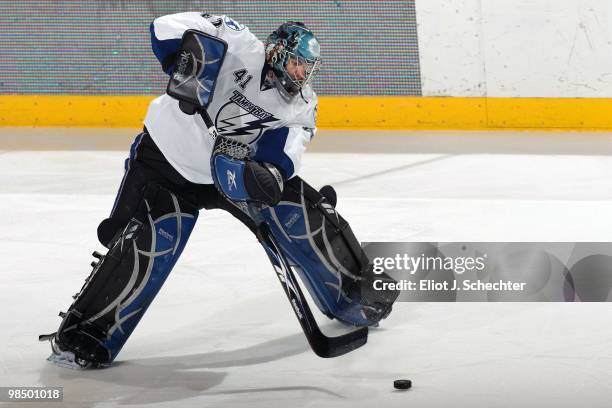 Goaltender Mike Smith of the Tampa Bay Lightning keeps the puck in play against the Florida Panthers at the BankAtlantic Center on April 11, 2010 in...