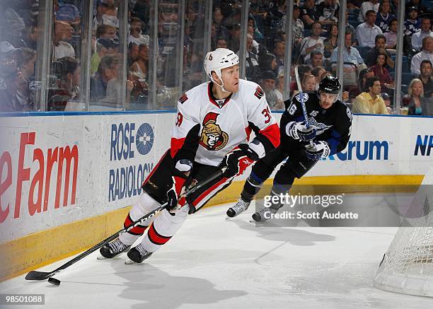 Matt Carkner of the Ottawa Senators controls the puck against the Tampa Bay Lightning at the St. Pete Times Forum on April 8, 2010 in Tampa, Florida.