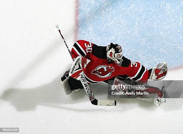 Martin Brodeur of the New Jersey Devils defends his goal against the Philadelphia Flyers in Game One of the Eastern Conference Quarterfinals during...