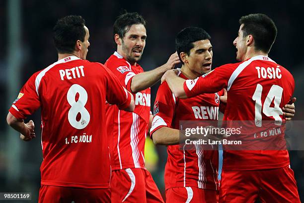 Zoran Tosic of Koeln celebrates scoring first goal with team mates Petit, Fabrice Ehret and Taner Yalcin during the Bundesliga match between 1. FC...