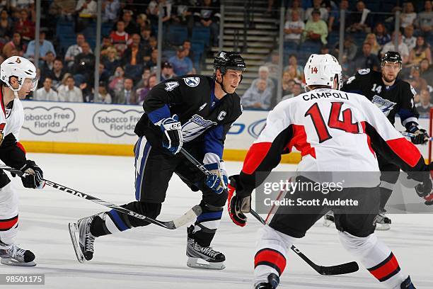 Vincent Lecavalier of the Tampa Bay Lightning controls the puck against Chris Campoli of the Ottawa Senators at the St. Pete Times Forum on April 8,...