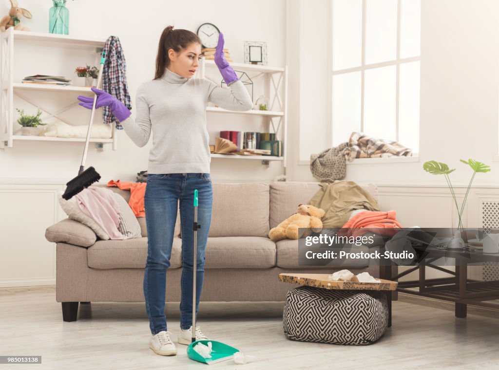 Woman with special equipment cleaning house