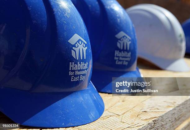 Hard hats with the Habitat for Humanity logo sit on a table at a construction site April 16, 2010 in Oakland, California. Habitat for Humanity East...