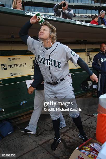 Eric Byrnes of the Seattle Mariners pouring water over his face prior to the game against the Oakland Athletics at the Oakland Coliseum in Oakland,...